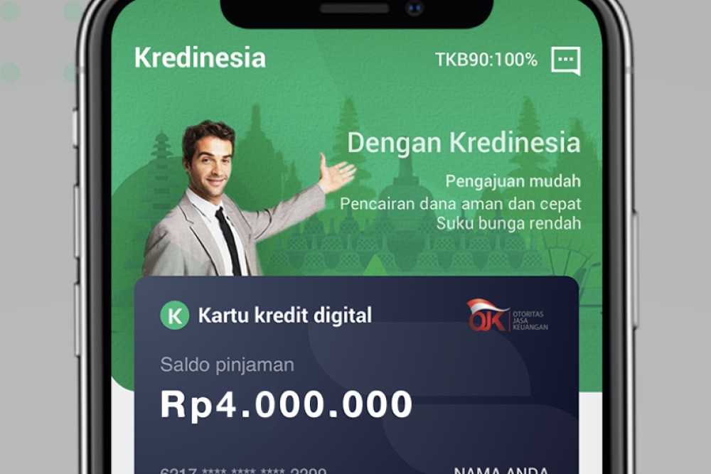  A mobile application for Kreditnesia, a digital credit card, with a man in a suit holding a phone in his hand.